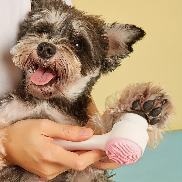 Mingle moa Small dog enjoying the mingle moa Silicone Pet Paw Cleaner & Grooming Brush, highlighting its soft bristles and comfort.